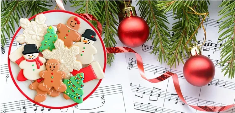 Christmas Cookies & Carols Festive Christmas cookies with snowmen and gingerbread men on sheet music.